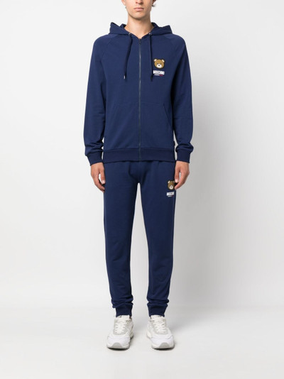 Moschino logo-patch track pants outlook
