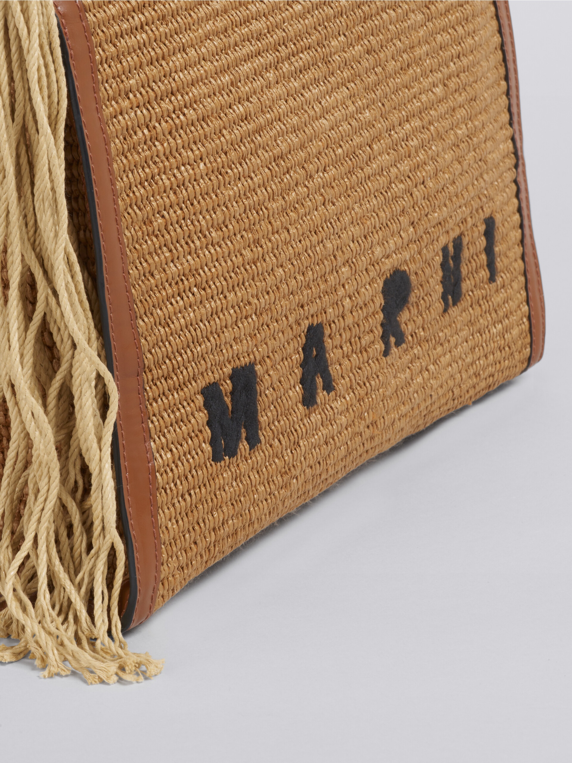 Marcel leather-trimmed embroidered raffia shoulder bag