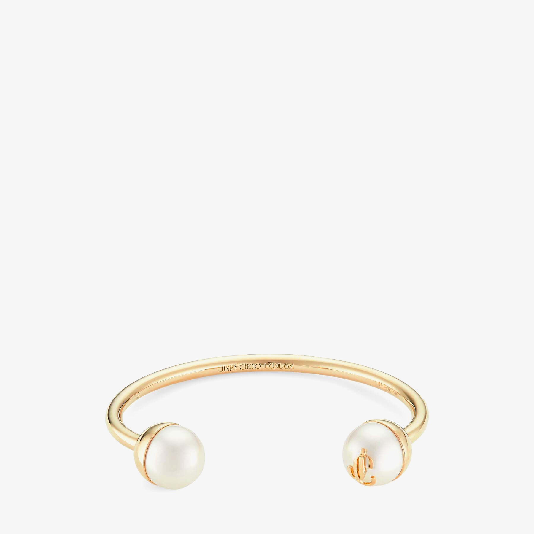 JC Pearl Cuff
Gold-Finish Metal Cuff Bracelet with Pearls - 1