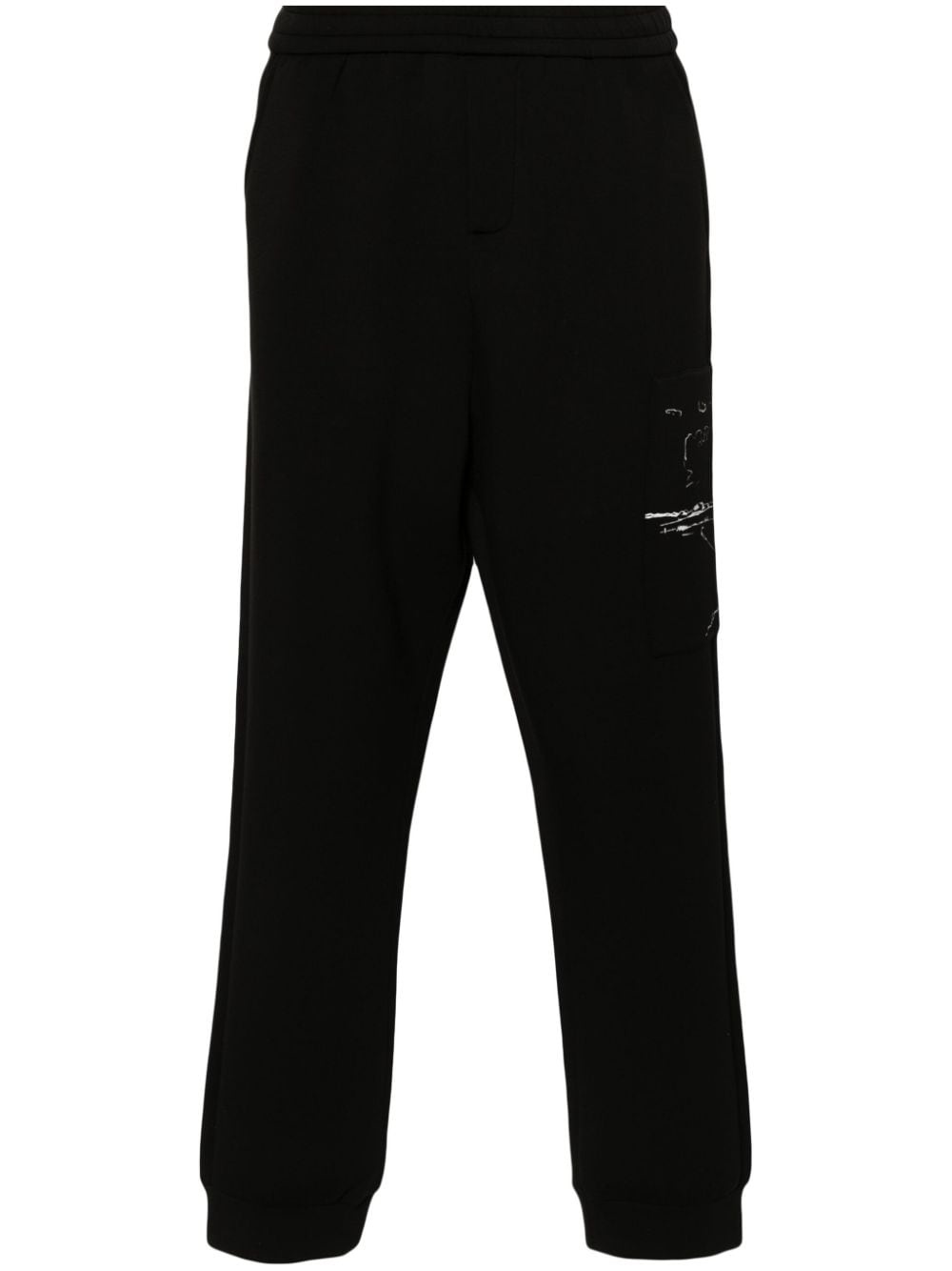 graphic-print tapered trousers - 1