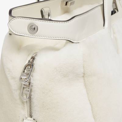 FENDI Peekaboo ISeeU Forty8 bag made of soft white sheepskin with an oversized shaved O’Lock motif. Roomy  outlook