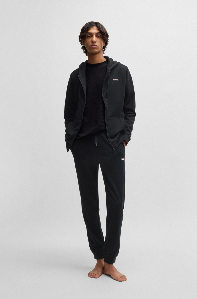 HUGO TRACKSUIT BOTTOMS WITH HEART LOGO outlook