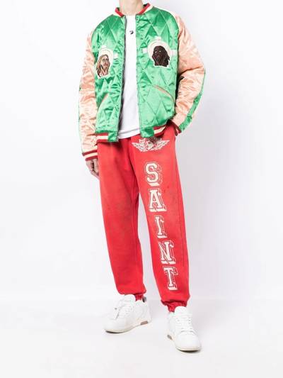 SAINT M×××××× graphic-print track pants outlook