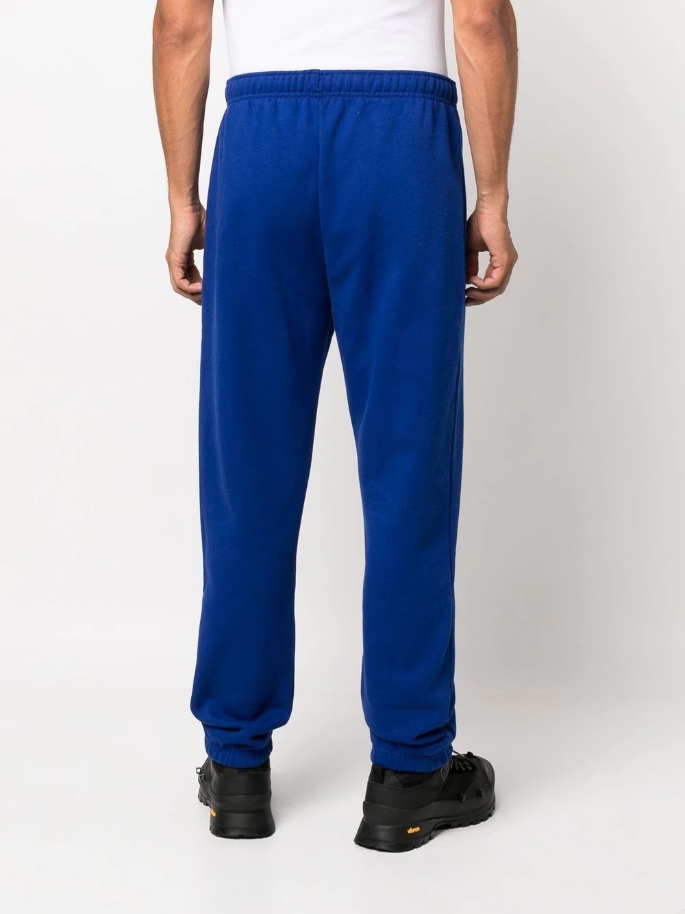 x KAWS logo-print track pants - 4