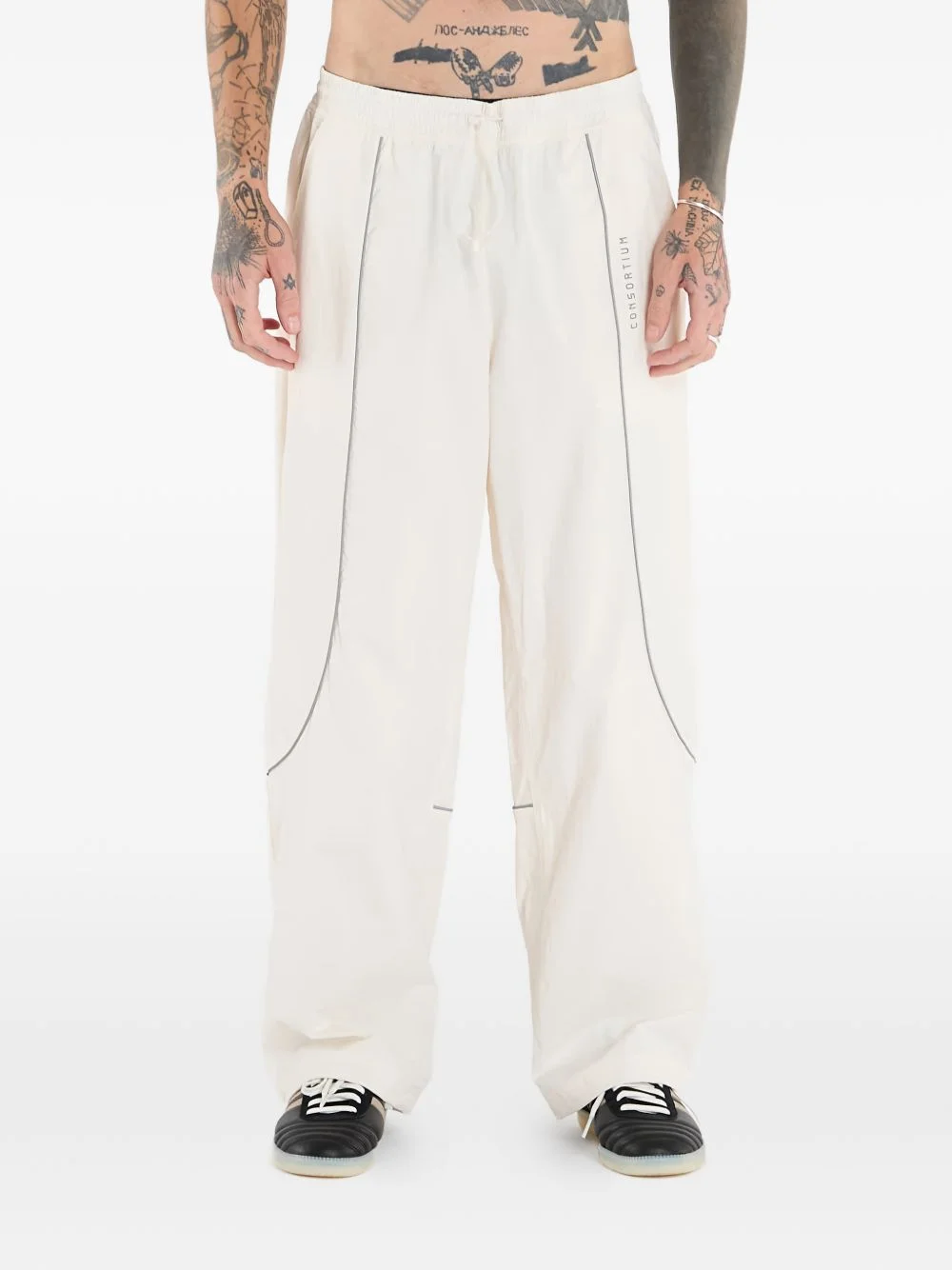 x Consortium stripe-detail track pants - 1