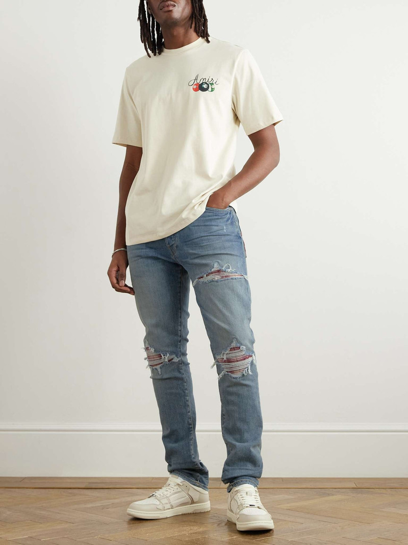 AMIRI Skinny-Fit Distressed Patchwork Jeans outlook