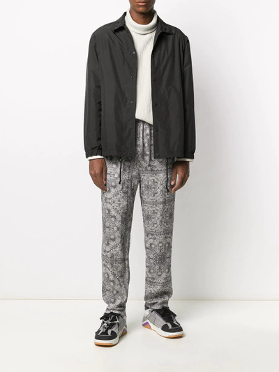 White Mountaineering bandana-print trousers outlook