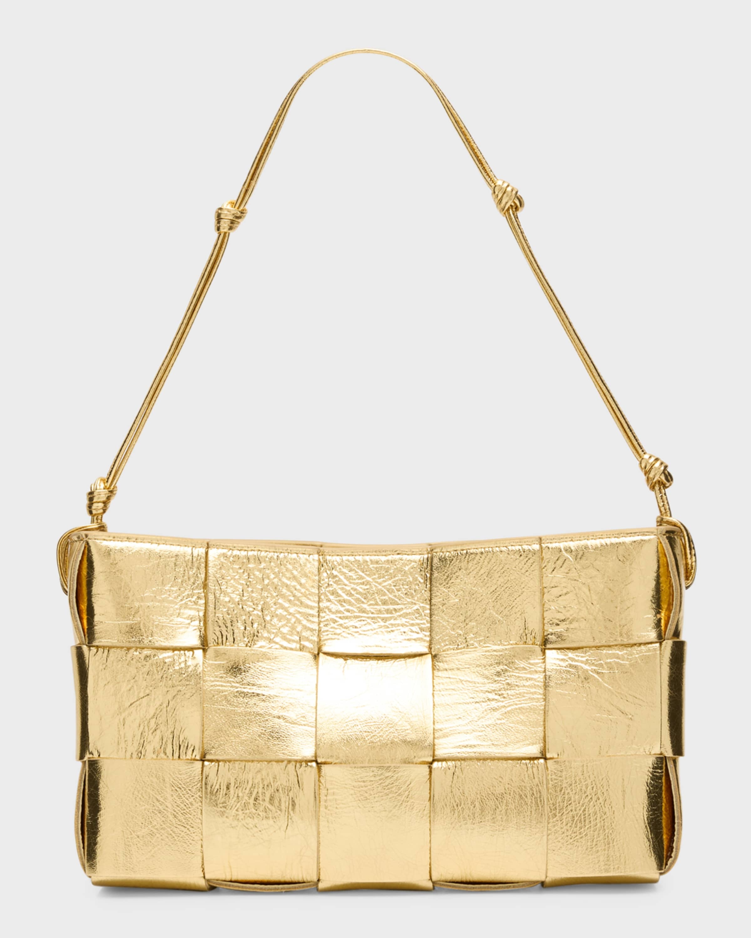 ショルダーバッグ・ポシェット BOTTEGA VENETA Baguette Pochette Shoulder Bag Bottega Veneta Baguette Pochette in Black & Gold | FWRD