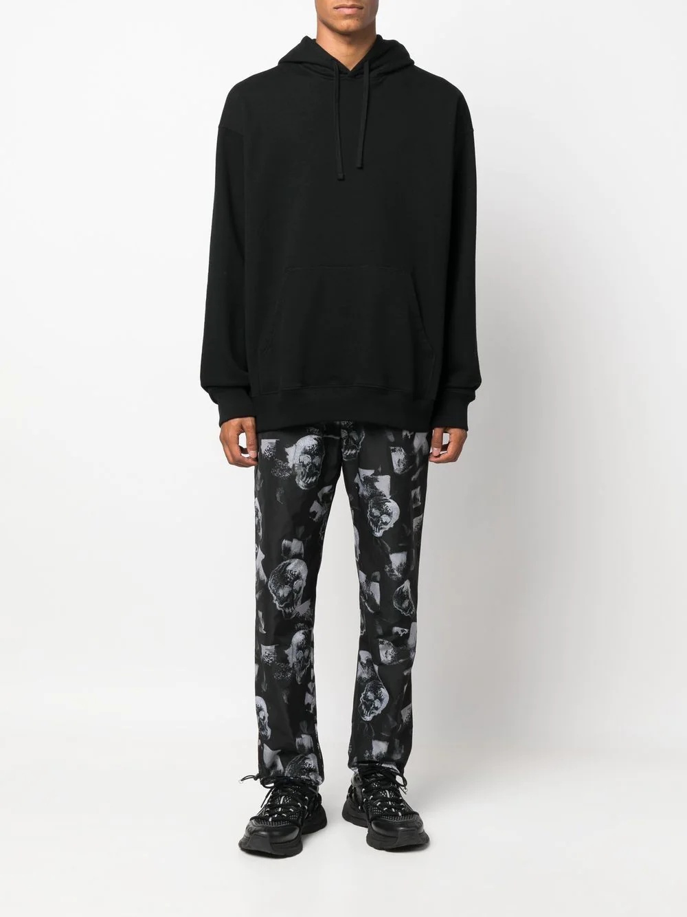 all-over skull-print trousers - 2