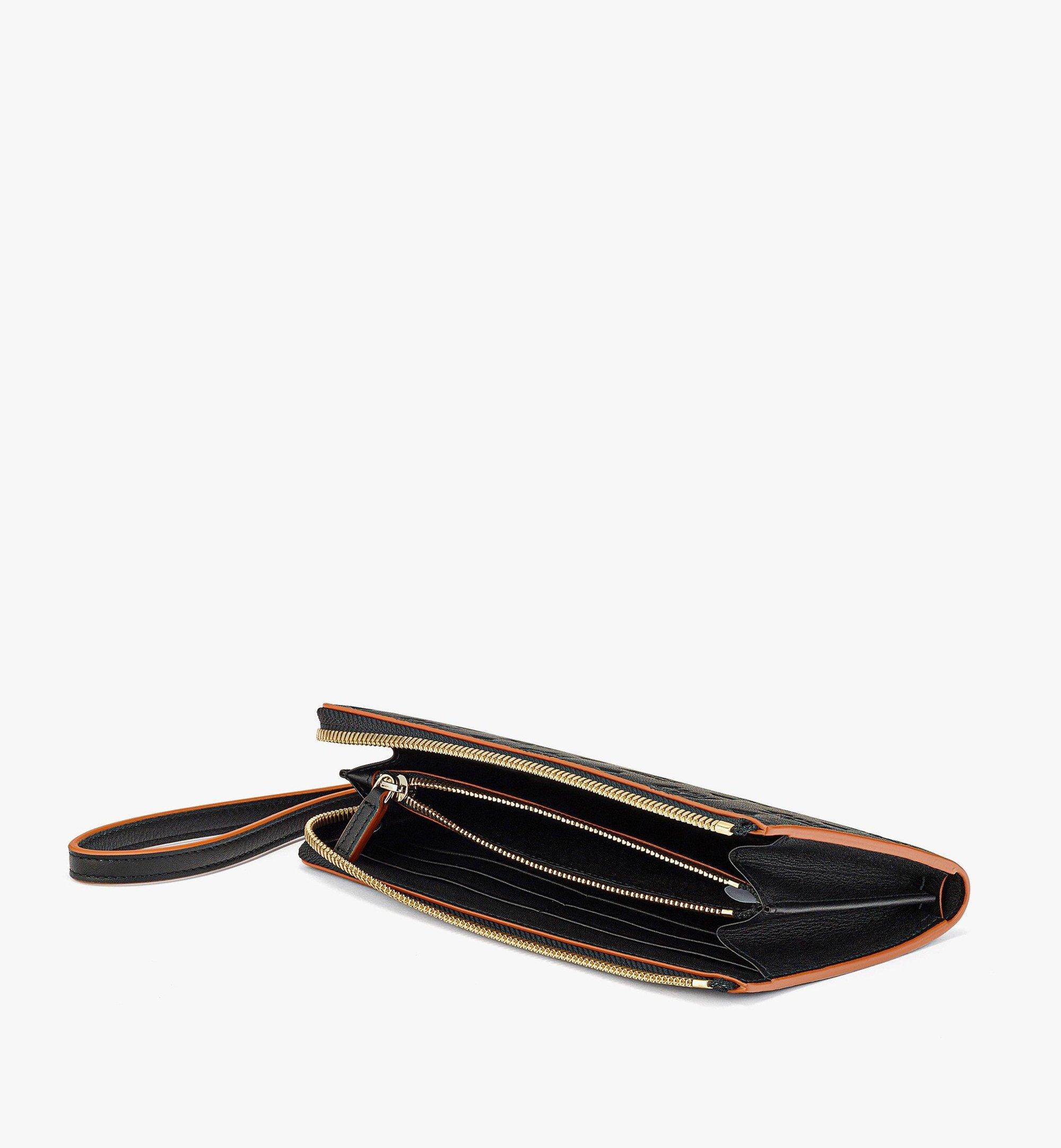 MCM Aren Zip Around Wallet in Embossed Monogram Leather | REVERSIBLE
