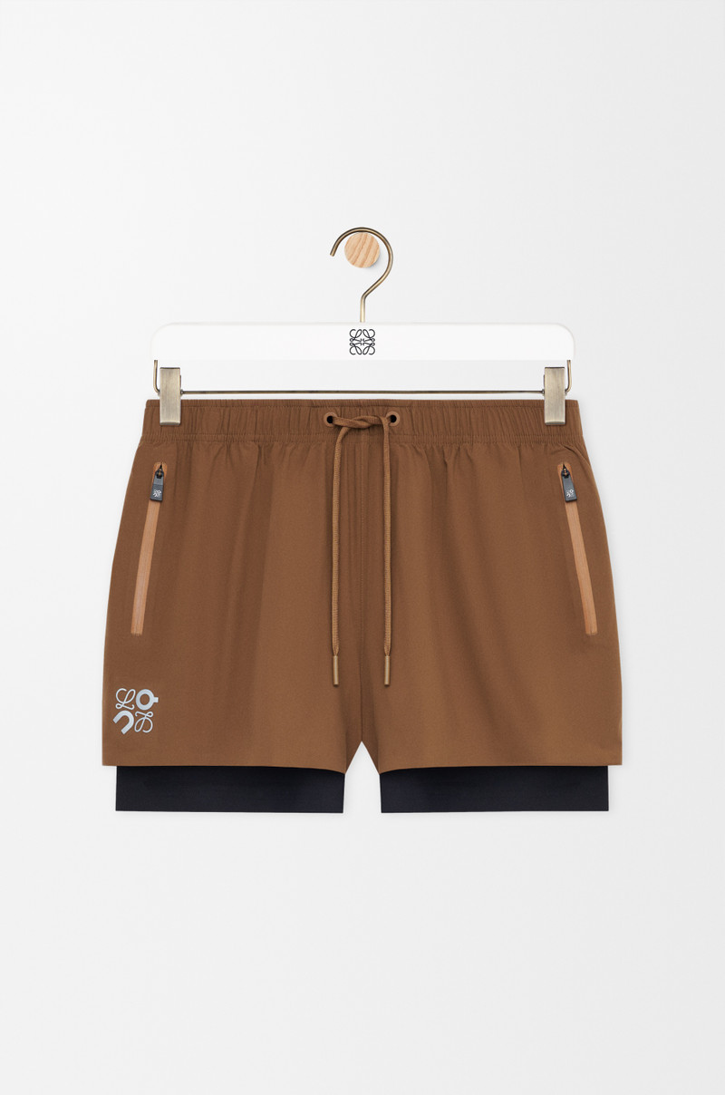 Performance shorts in technical shell 1