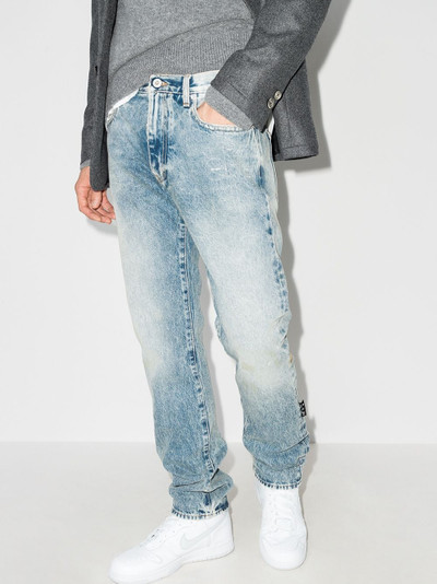 Off-White logo-print slim-cut jeans outlook