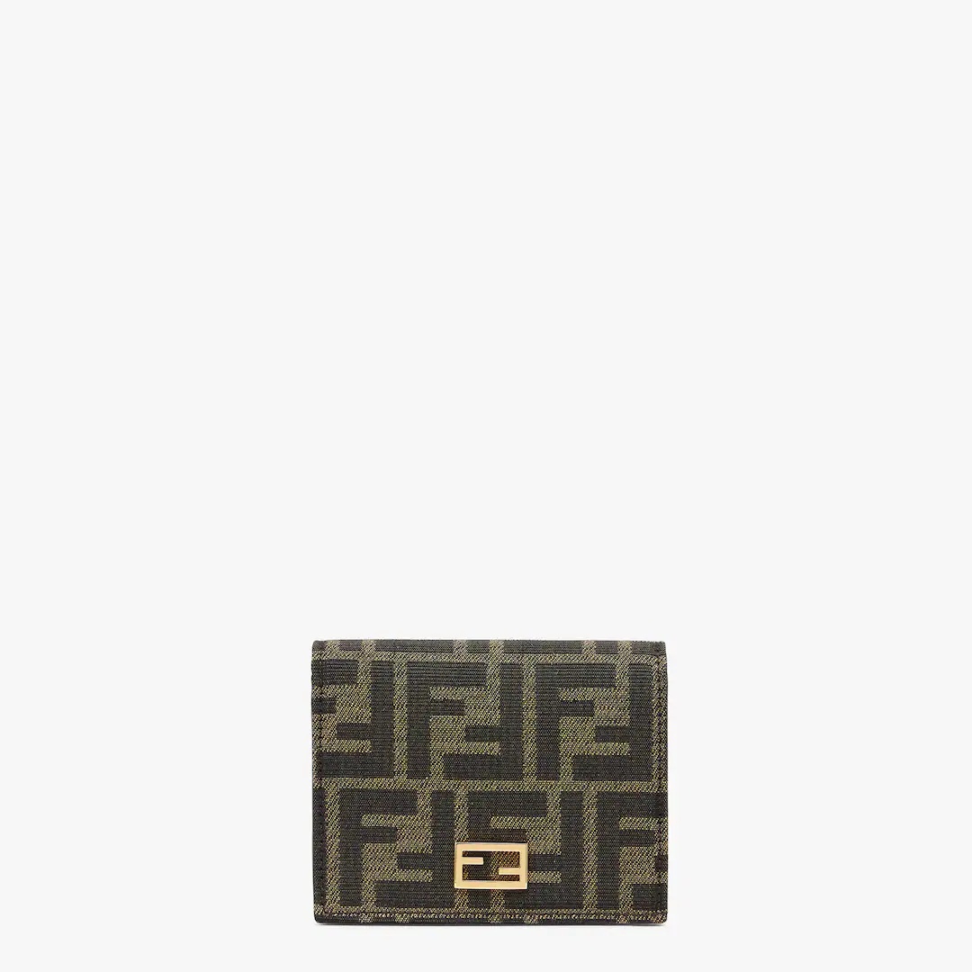 Small Baguette bi-fold wallet. Interior organized with flat pockets, a coin pocket with zip, four ca - 1