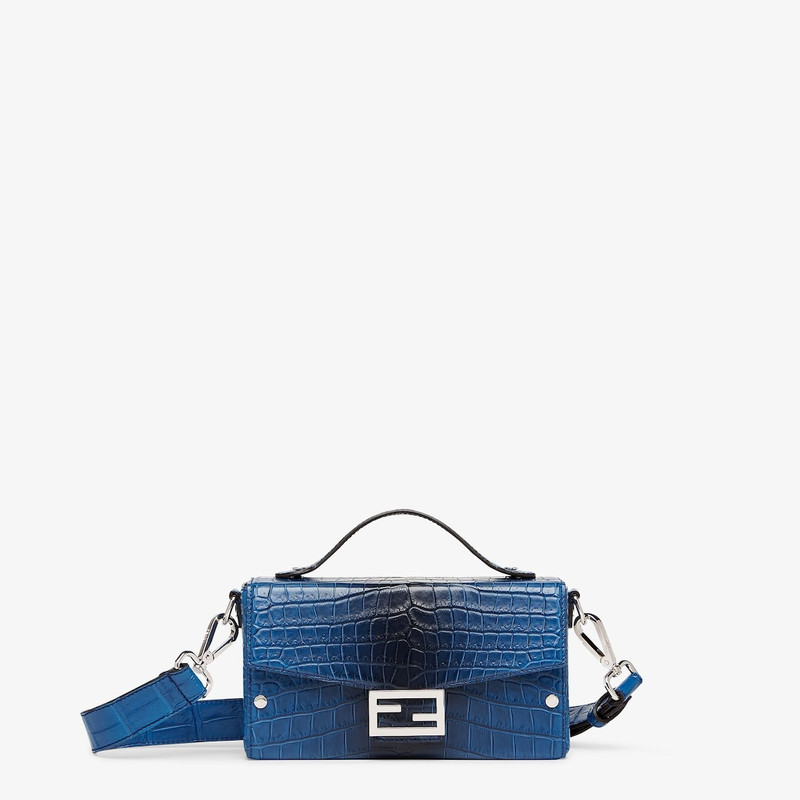 Soft Trunk Baguette bag made of exquisite matte crocodile leather in graduated blue tones. Flap with 1