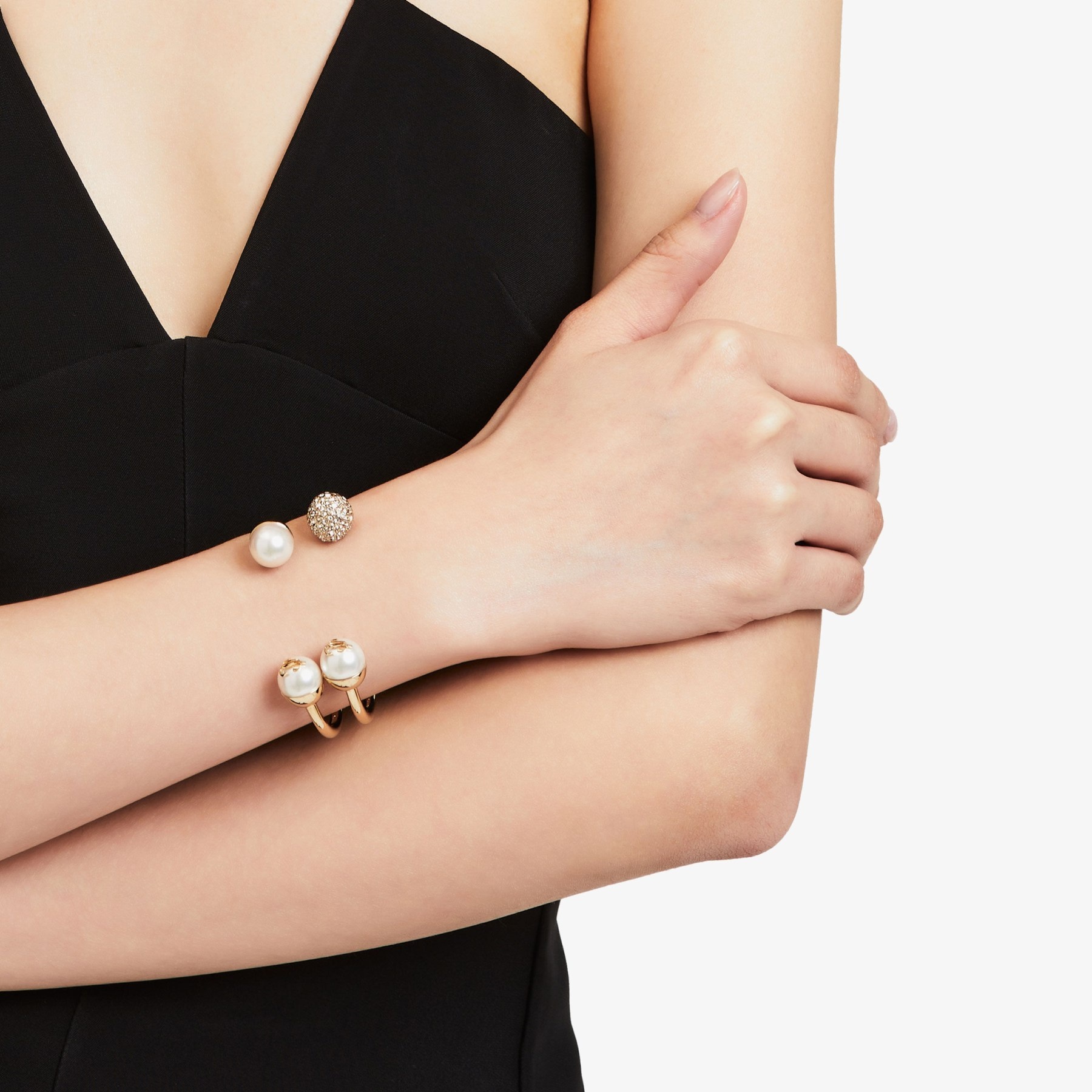 JC Crystal Cuff
Gold-Finish Metal Cuff Bracelet with Pearl and Swarovski Crystal Embellishment - 6