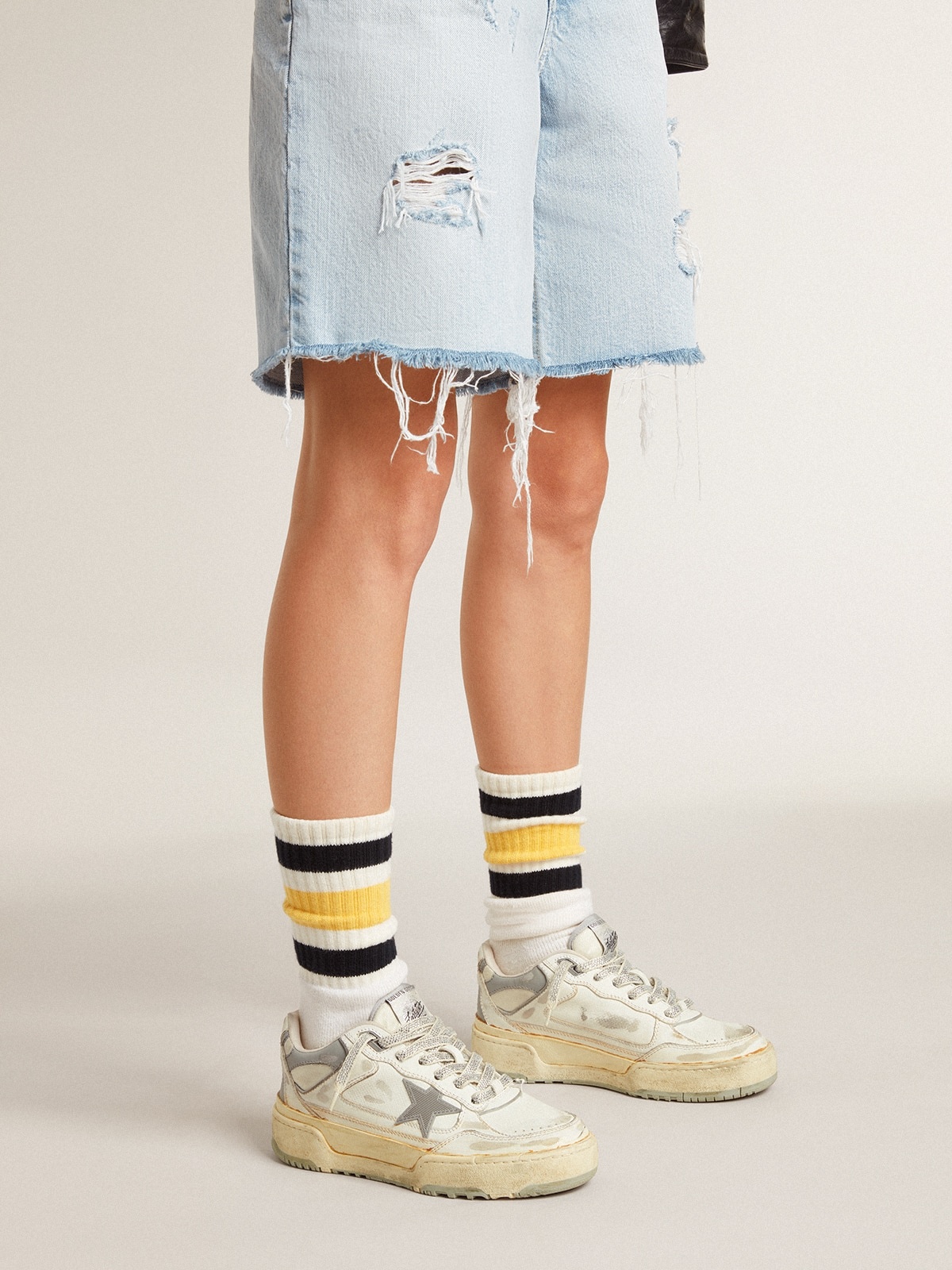 Worn-white socks with distressed details and black and yellow stripes - 4