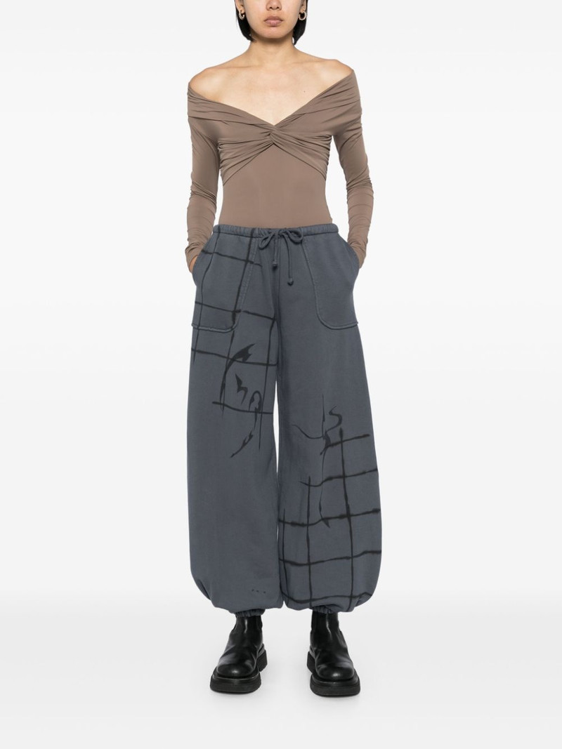Collina Strada graphic print track pants outlook