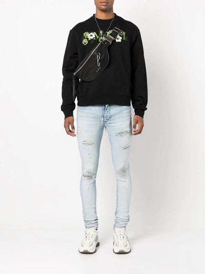 AMIRI distressed ripped skinny jeans outlook