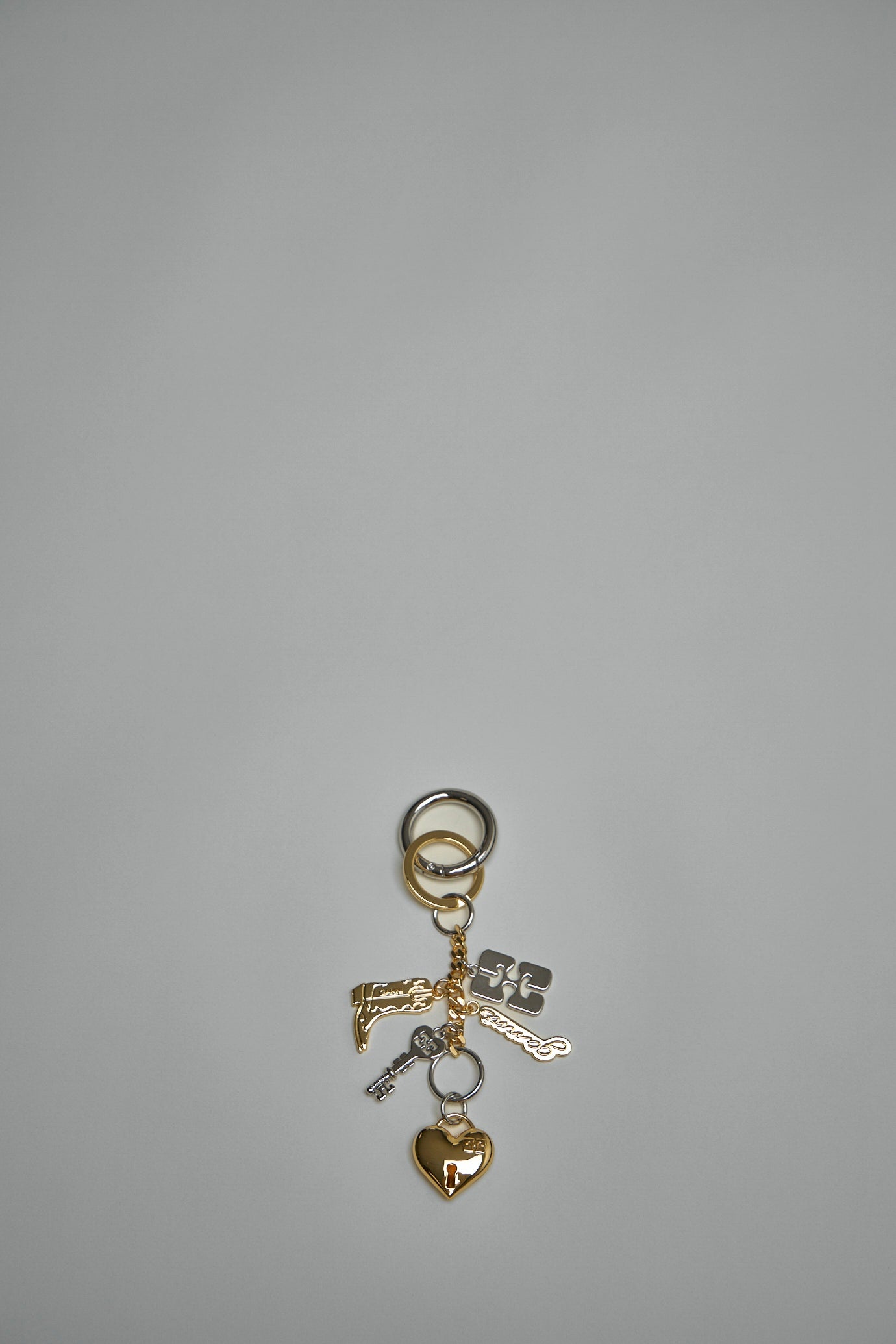 【GANNI 】Silver and Gold Ganni Bou Charms Key Ring GANNI Silver and Gold Ganni Bou Charms Key Ring | Shopbop