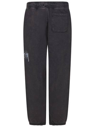 Stüssy Black screen-printed tracksuit trousers with contrasting logo print on the front. outlook