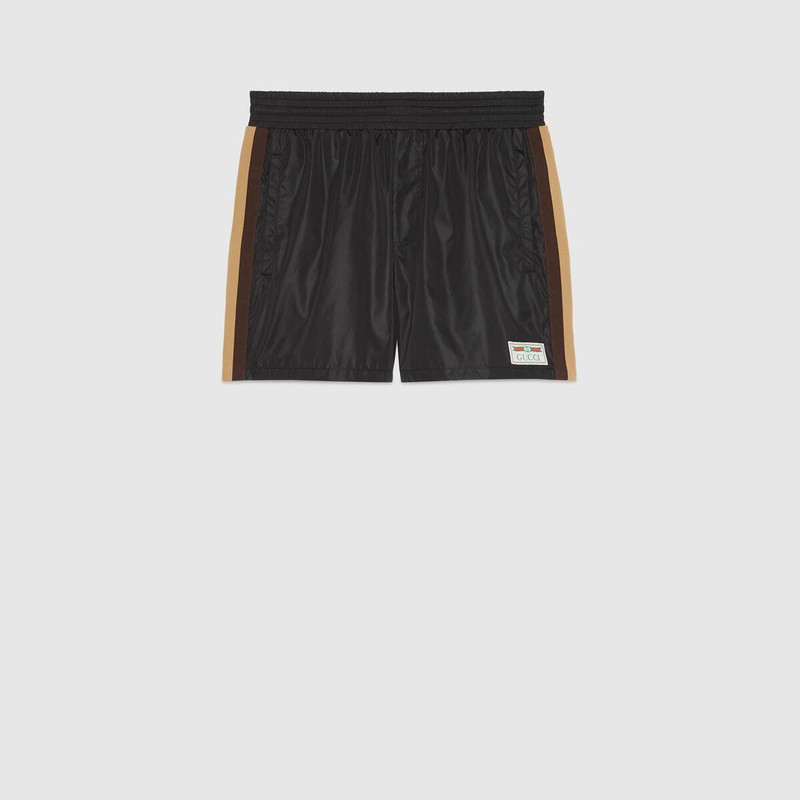 Swim shorts with Gucci label 1