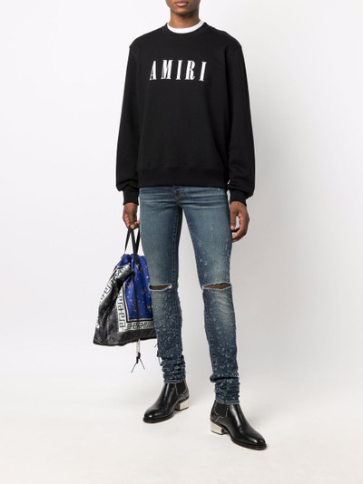 AMIRI Shotgun distressed skinny jeans outlook