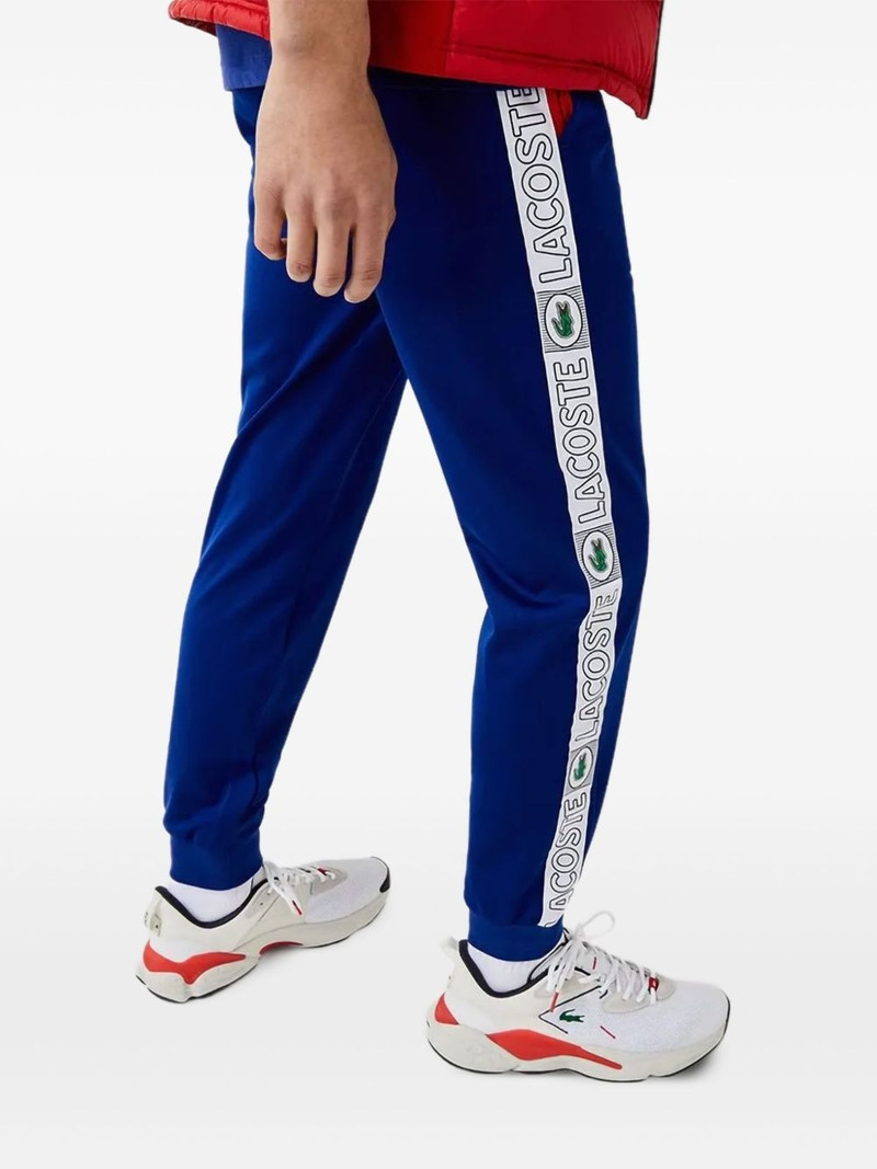 LACOSTE logo-tape "Cosmic" track pants outlook