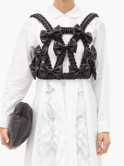 Noir Kei Ninomiya Bow-trimmed faux-leather harness top outlook