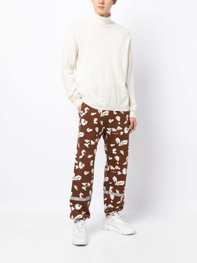 UNDERCOVER abstract-print track pants outlook