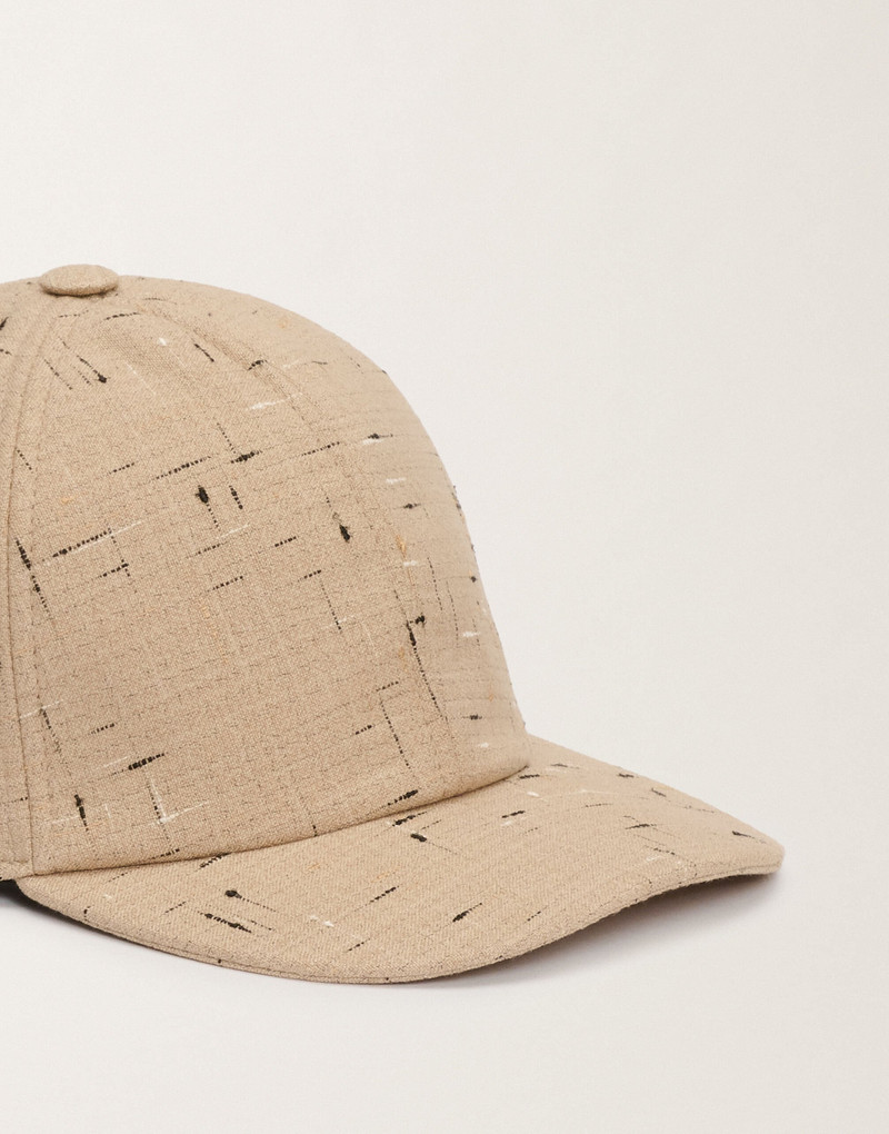 Baseball cap in buttoned tailoring 3