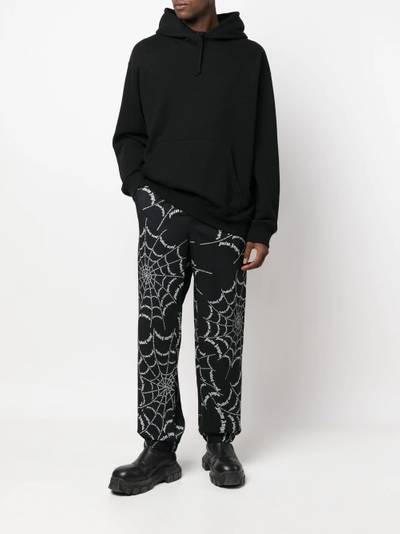 Palm Angels spider web print track pants outlook