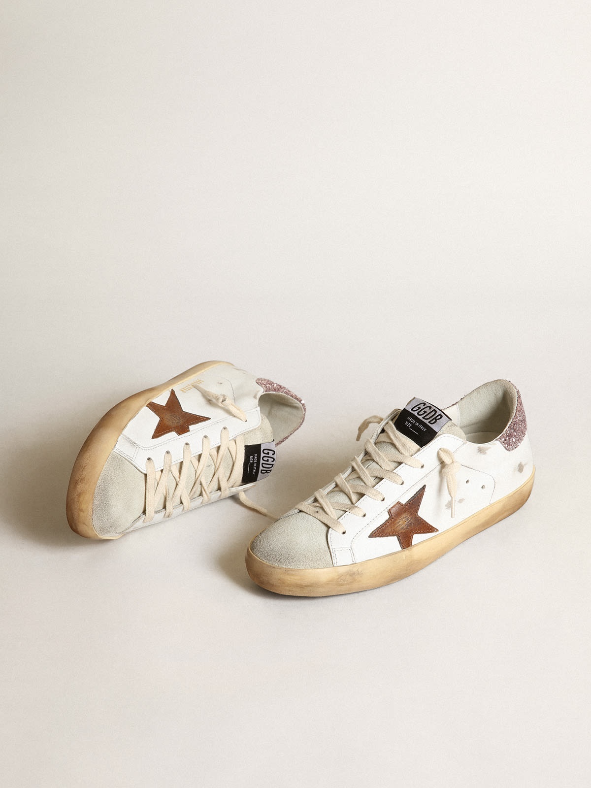 Golden Goose Super-Star with a tan star and pink glitter
