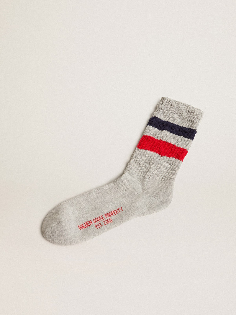 Gray socks with contrasting red and blue stripes and red logo 1