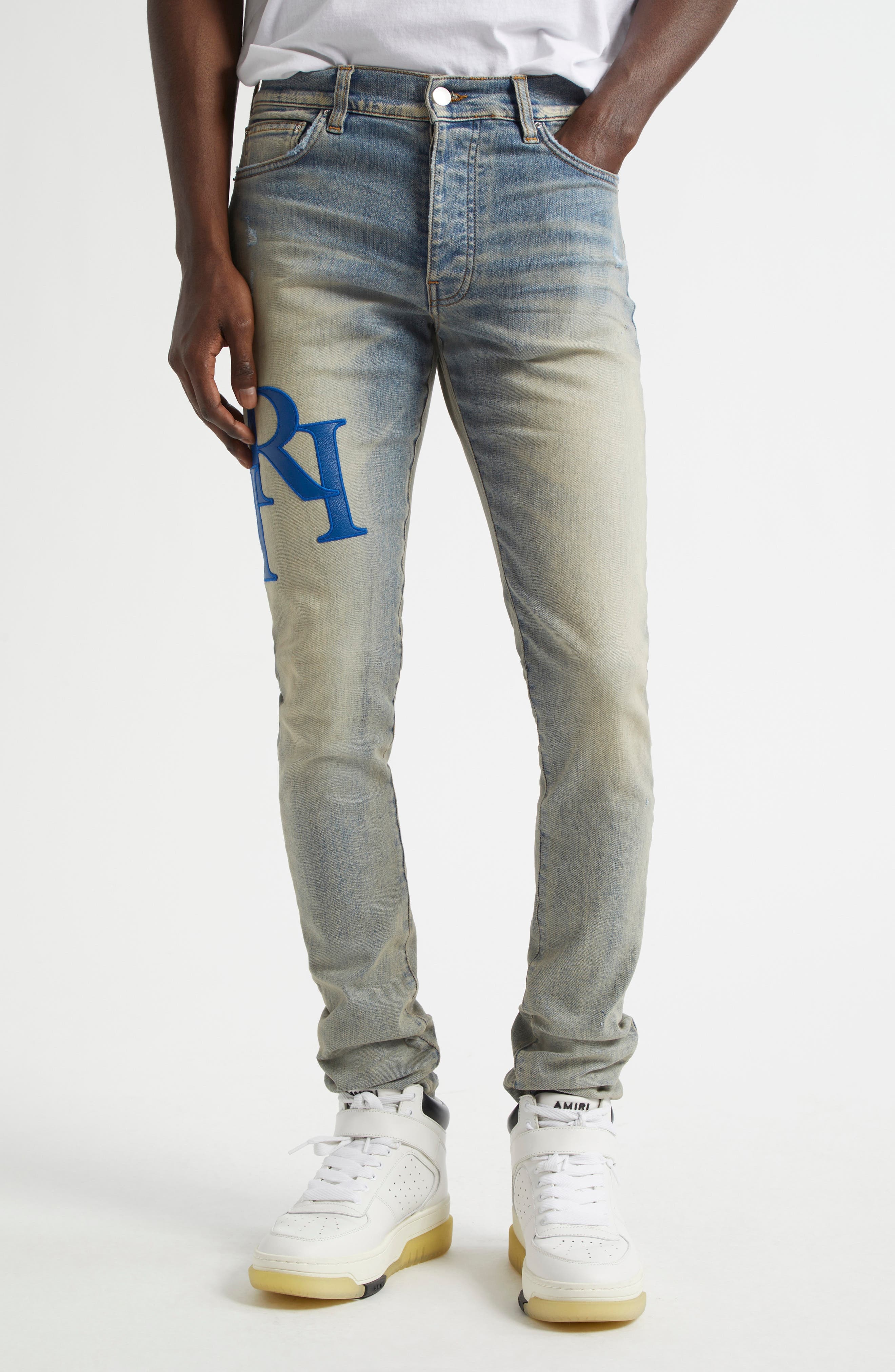AMIRI Staggered Logo Skinny Jeans in Antique Indigo Blue at Nordstrom - 1