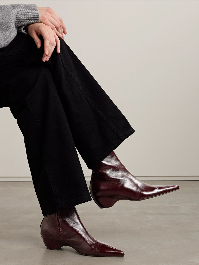 KHAITE Sybil glossed-leather ankle boots Merlot outlook