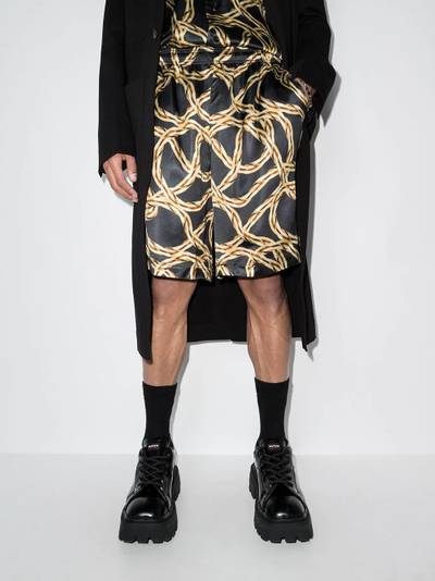 VETEMENTS chain-print bermuda shorts outlook