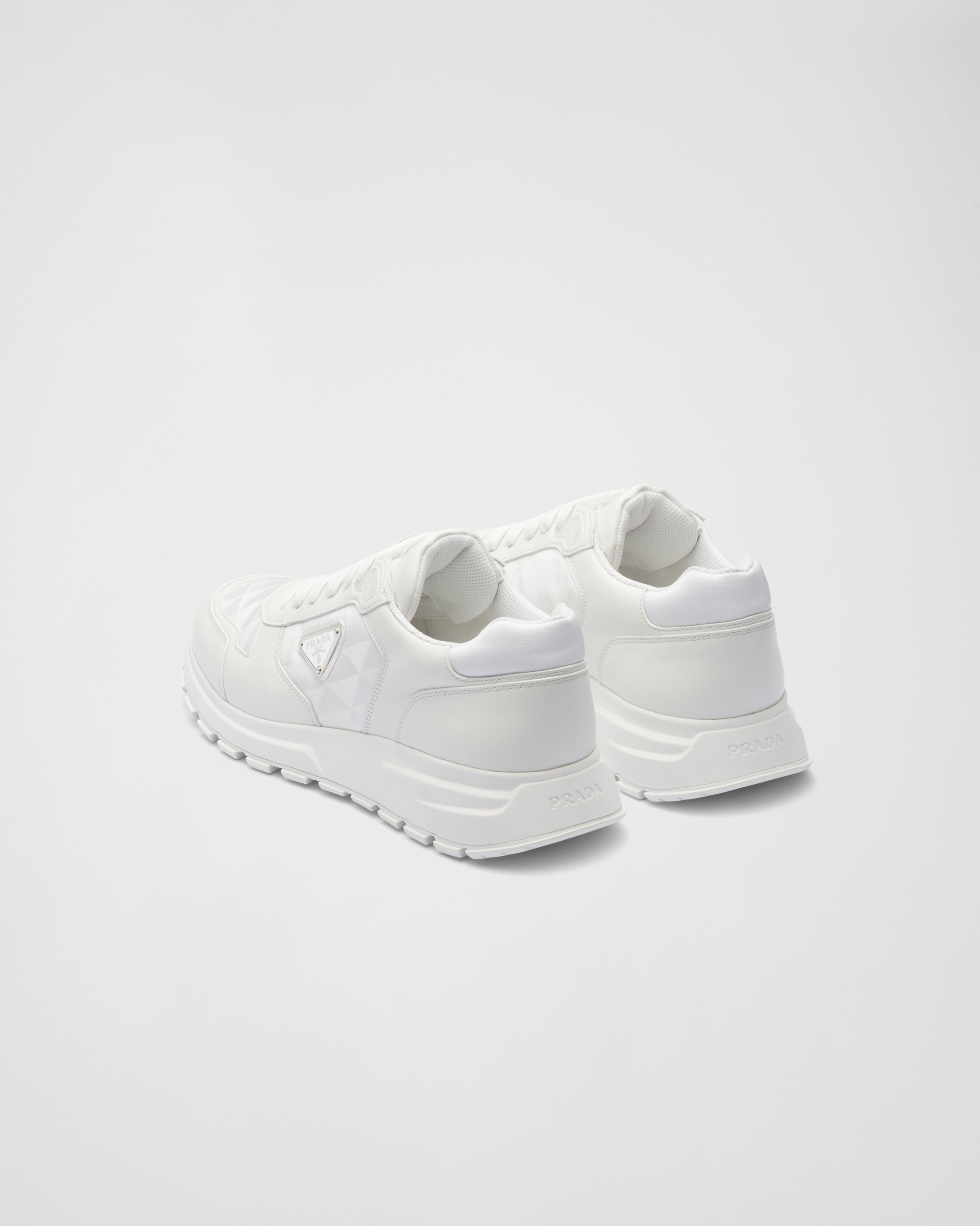 【関税込・国内発送】PRADA Re-Nylon and mesh sneakers Re-Nylon and mesh sneakers in black - Prada | Mytheresa