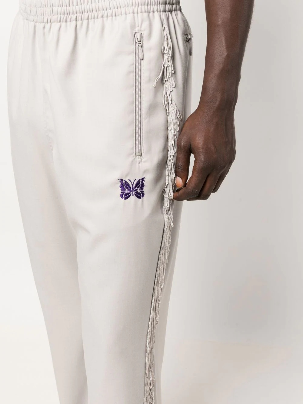 logo-embroidered tasseled trousers - 10