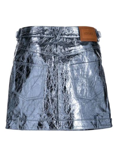VERSACE x Dua Lipa metallic leather miniskirt outlook