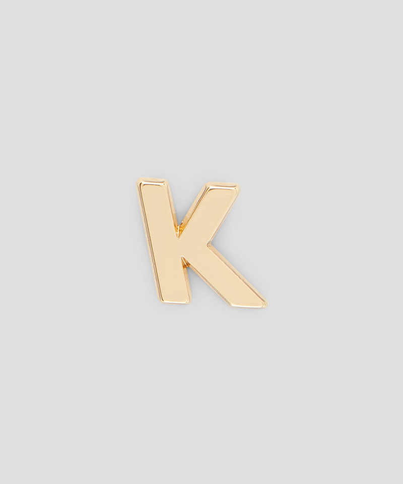 Single brass K charm 1