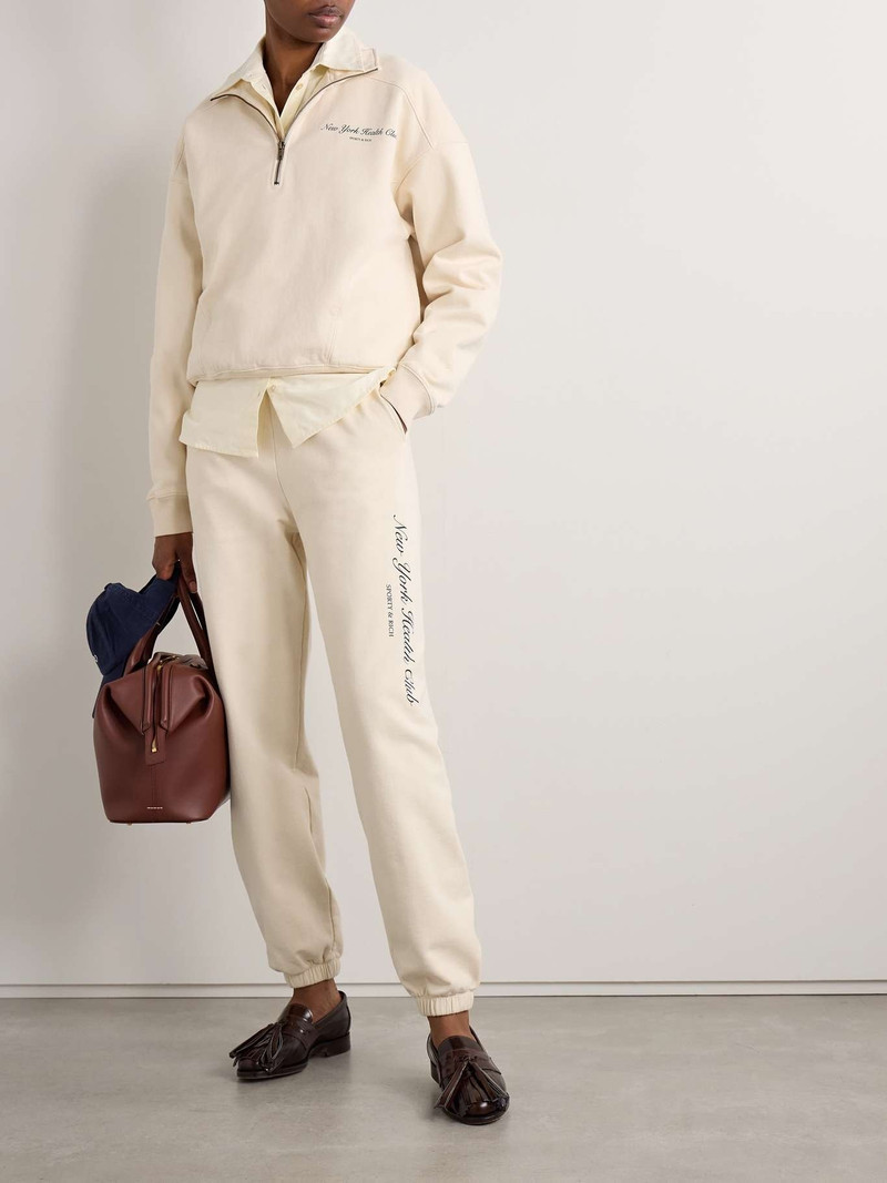 Sporty & Rich Printed cotton-jersey track pants Cream outlook