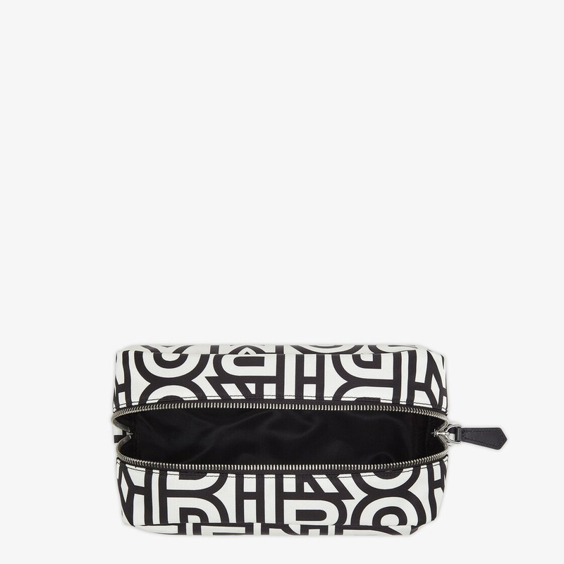 Small toiletry case with large inside compartment and zip fastening. Made of nylon printed with the  3