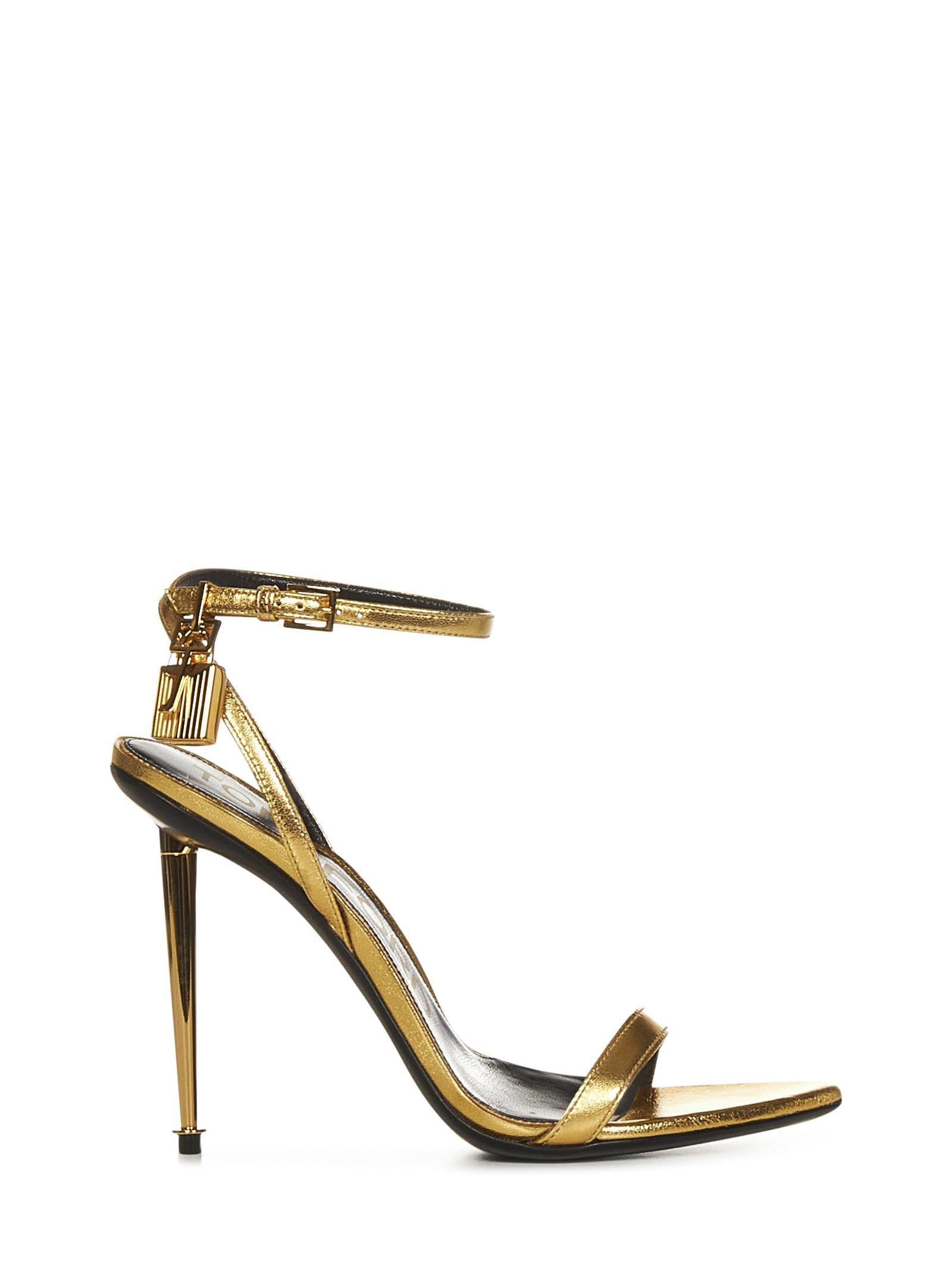 Gold laminated nappa leather sandals with golden metal padlock and spike heel. - 1