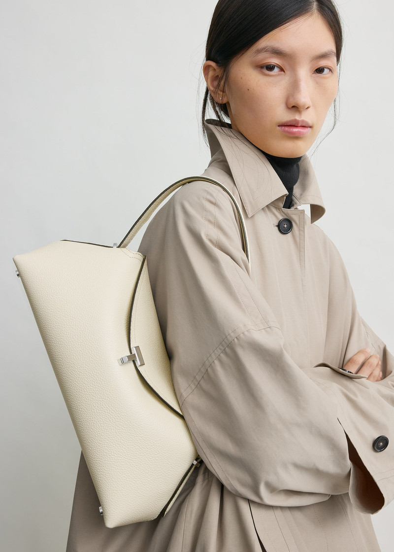 TOTEME T-lock grained-leather shoulder milk outlook