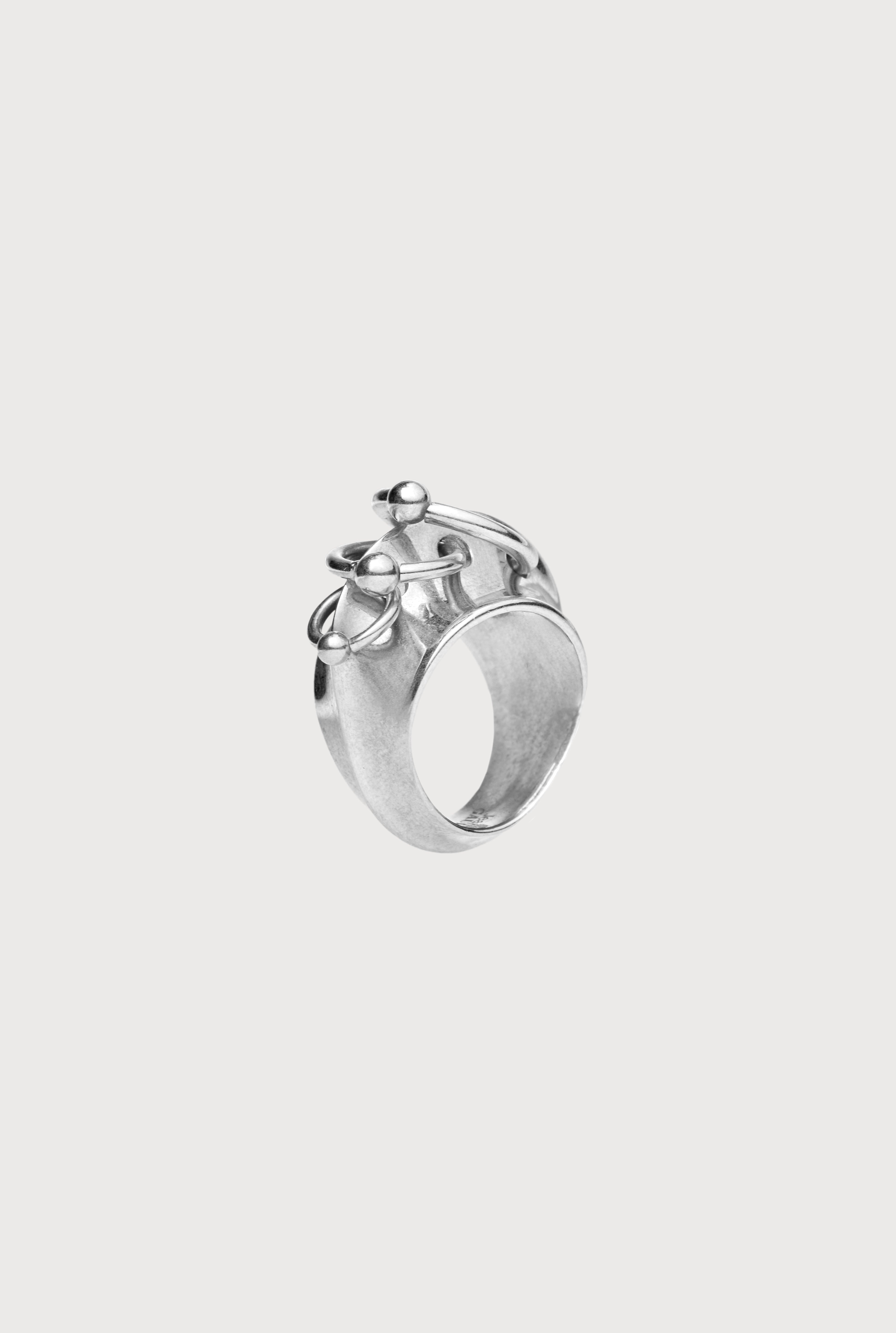 THE SILVER-TONE PIERCING RING - 1