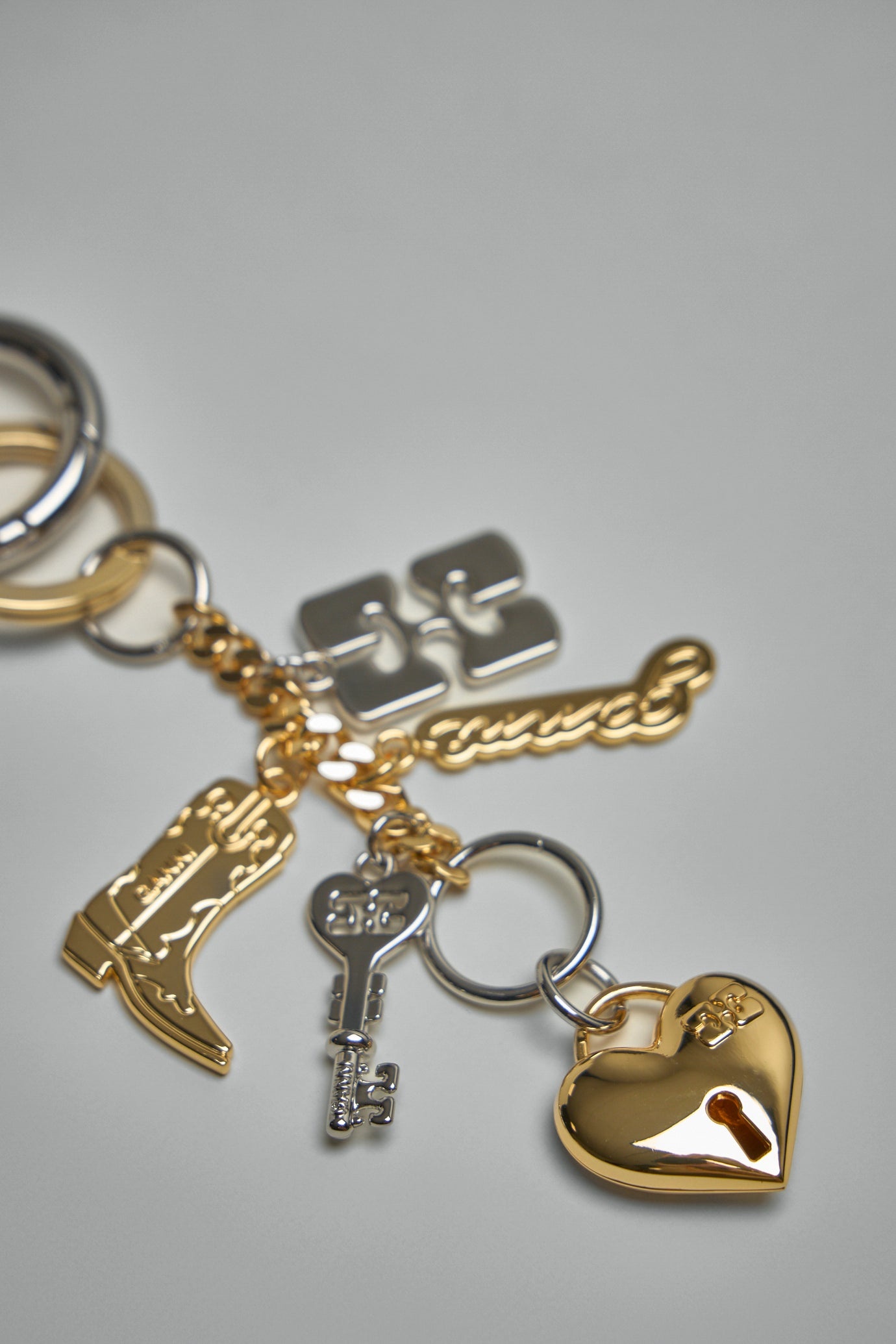 【GANNI 】Silver and Gold Ganni Bou Charms Key Ring Silver Metallic Silver GANNI Bou Keyring | GANNI US