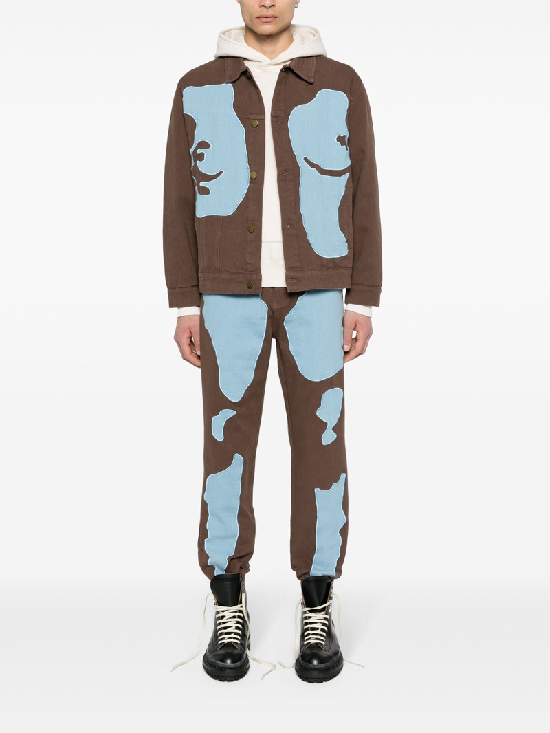 KidSuper patchwork-detailed tapered jeans outlook