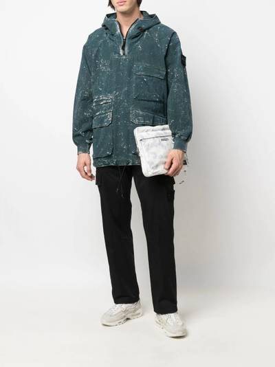 Stone Island paint-splatter hooded windbreaker outlook