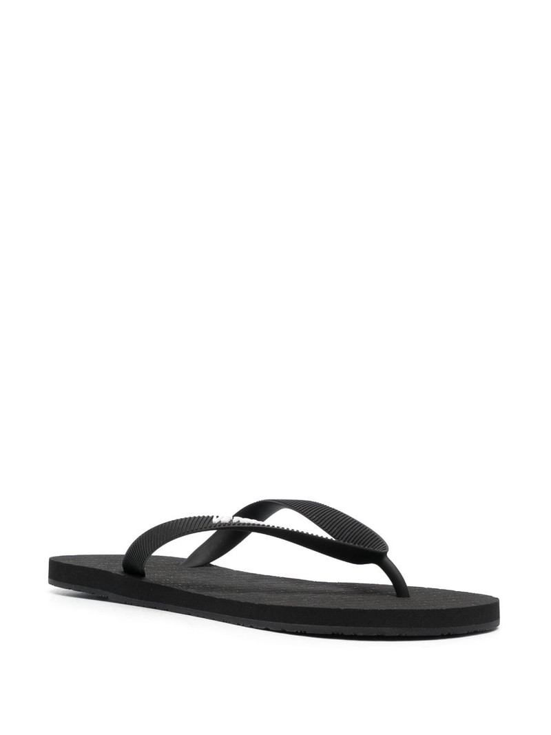 VETEMENTS logo-embossed flip flops outlook