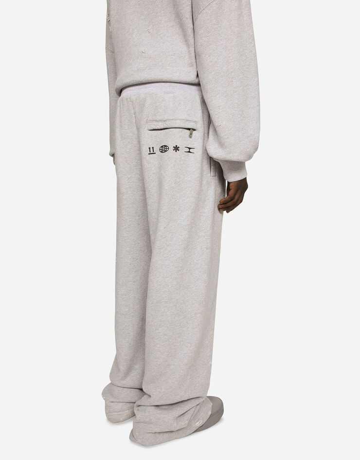 Printed jogging pants with small abrasions - 5